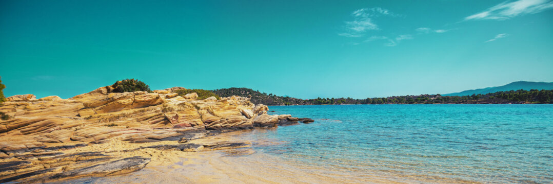 Seascape on a sunny day. Rocky beach