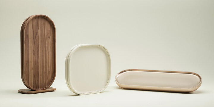 Three decorative trays in walnut wood, cream resin, and polished rose gold metal finish
