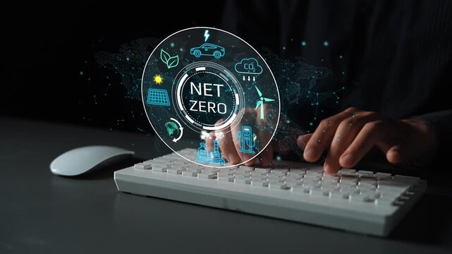 Futuristic digital concept depicting net zero emissions with various icons, a hand typing on a keyboard, emphasizing sustainability and technology in modern workspace. Entropy.