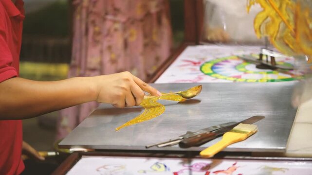 Traditional Chinese Sugar Painting Being Made by a Street Artist