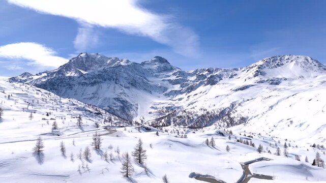 Simplon Pass and Mount Fletschhorn covered in fresh snow, Swiss Alps. Drone view