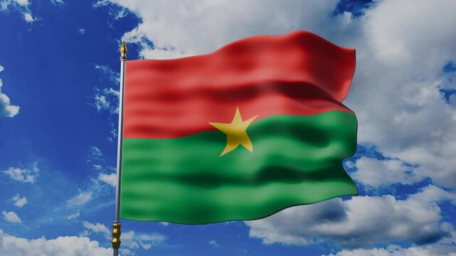 Burkina Faso Flag Waving Against Blue Sky