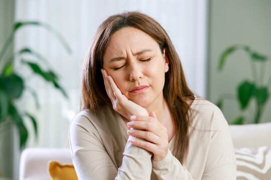 Young woman with toothache