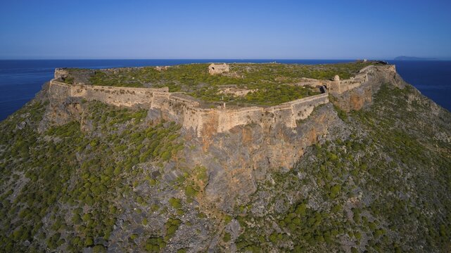 Drone shot, Historic fortress on rocky cliffs under a clear sky, Venetian sea fortress, Gramvoussa, Gramvoussa peninsula, Pirate Bay, Balos, Lagoon, Northwest Crete, Crete, Greek Islands, Greece