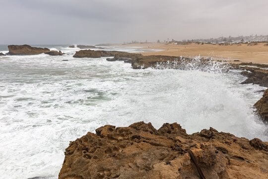Ocean surf against rocks on a stormy coastline