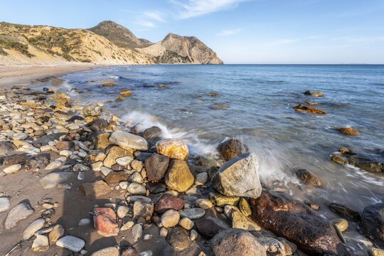 Beach with coloured stones, sandy beach with rocky cliffs, Paralia Paradisos, Kos, Dodecanese, Greece