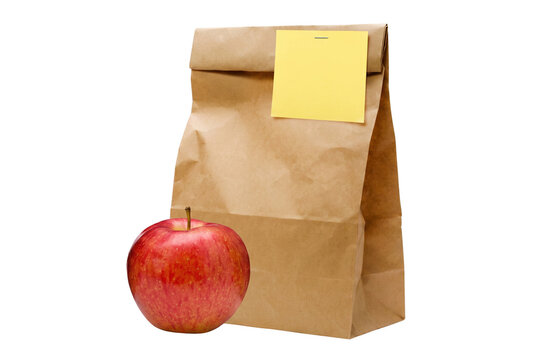 Brown paper lunch bag with yellow sticky note and a red apple