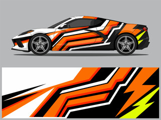 Fototapeta premium Dynamic sports car with vibrant geometric racing wrap design.
