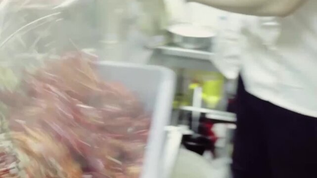 Cooking boiled crawfish in a large pot with spicy broth and steam rising, close-up food preparation