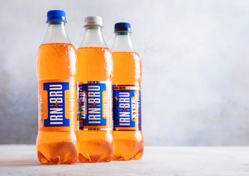 LONDON,UK - APRIL 11, 2026: Various bottles of Irn Bru soft soda drink on light table background.
