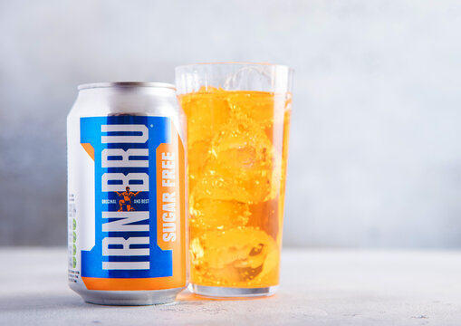 LONDON,UK - MARCH 01, 2026: Aluminium can of Irn Bru Sugar Free soft soda drink with glass of ice cubes on light table background.
