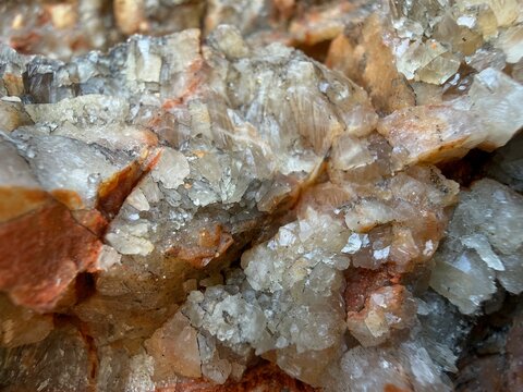 Rough mineral surface displaying intricate crystalline textures and earthy colors, forming a detailed geological pattern in manacor, balearic islands, spain