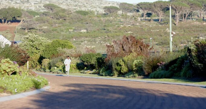 Lifestyle videos outdoor of people doing activities, jogging on scenic path, man enjoying outdoor ex