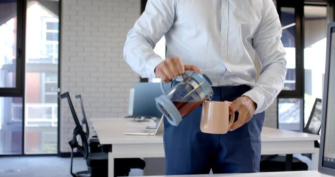 Lifestyle videos indoor of people doing activities at office, holding coffee mug, man stretching and