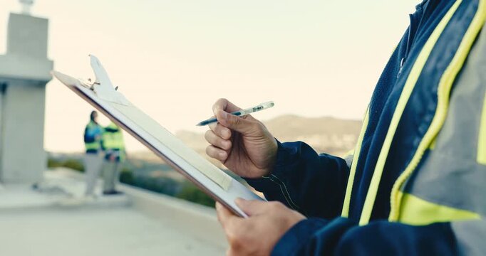 Hands, engineer and writing at site with clipboard, notes and inspection report for construction. Person, review or information on rooftop with checklist, blueprint and safety survey for architecture