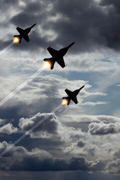 Air Force Day. Aircraft silhouettes on background of cloudy sky. Combat flight of interceptors on a mission. Vertical poster.