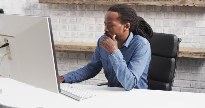 Lifestyle videos indoor of people doing activities at office, typing on keyboard, man working on des