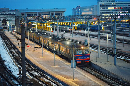 Minsk, Belarus. Feb 2, 2025. RVR ER9T passenger electric train on platform, servicing suburban commuter lines. Passenger electric train arrived at Minsk central station at night. Minsk Railway Station