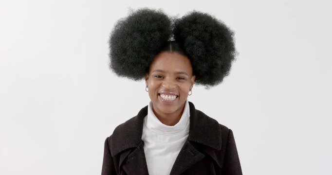 High speed photography for dynamic scenes, Smiling woman in black coat with afro hairstyle posing ag
