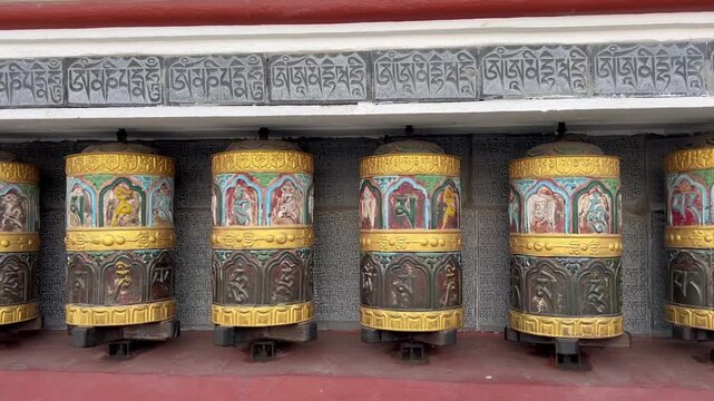 Tibetan prayer wheels spinning at Swayambhunath Stupa Complex in Kathmandu Nepal