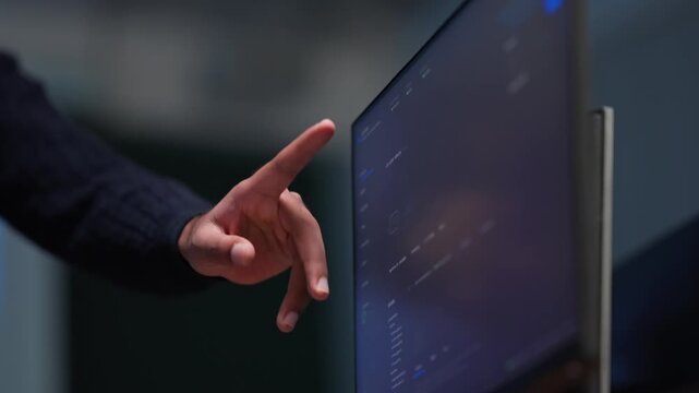 Close Up of Developer Pointing at Screen Displaying AI Code