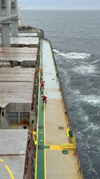 deck works of seafarers for cleaning, moping the ship deck.