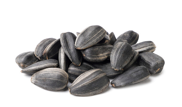 Pile of sunflower seeds close-up on a white background. Isolated