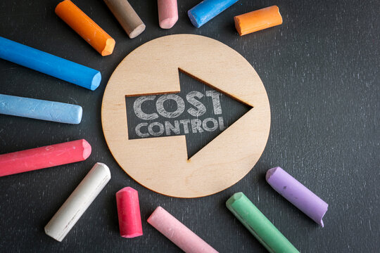 COST CONTROL Concept Displayed in a Wooden Arrow on a Chalkboard