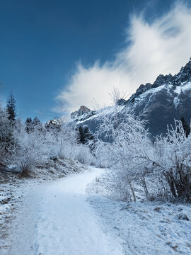 Snow covered mountain path leading away toward Les Drus Chamonix