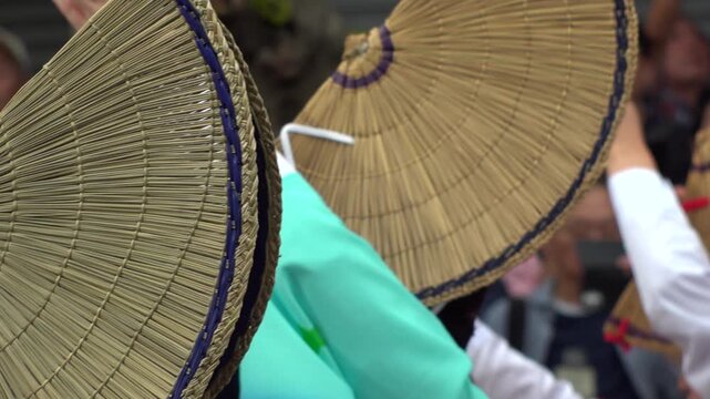 TOKYO, JAPAN - AUG 2026 : Slow motion shot of Awa Odori dance festival in Koenji. Powerful and energetic dance and music. Traditional Japanese summer event in Tokyo. Close up shot of lady dancer.