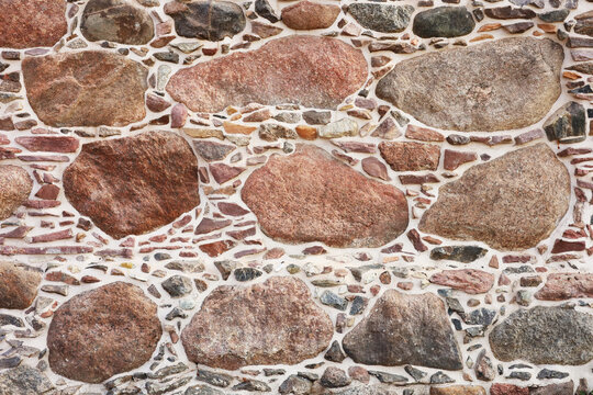 Rounded stones form rustic, uneven wall pattern