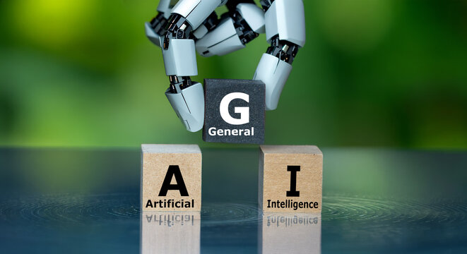 Robot hand places the General block between Artificial and Intelligence to form AGI, symbolising artificial general intelligence.