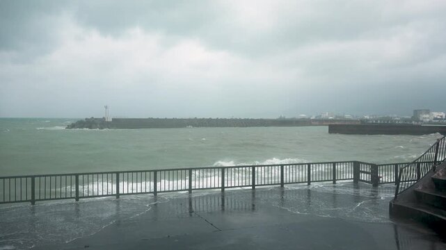 Huge Breaking Wave Explodes Over Coastal Waterfront During Hurricane