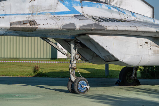 MiG jet aircraft showcases engineering marvel with detailed textures and contrasting colors during bright daylight in an outdoor exhibit