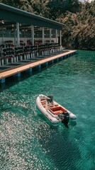 Fototapeta premium Inflatable boat docked at a tropical resort's dive center with scuba gear and clear turquoise water