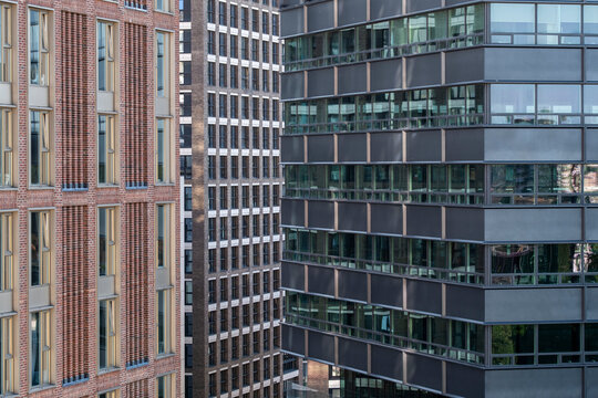 Layered modern buildings in London England form a dense urban cityscape with varied facades windows and architecture showing contemporary city development