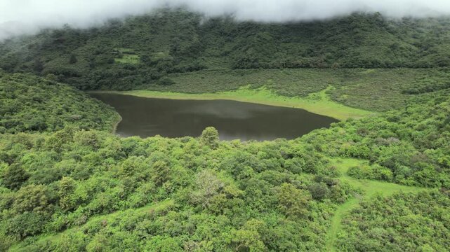 4K drone aerial view of Yala, Jujuy, Argentina. Misty mountain lakes surrounded by lush Yungas forests and dense green vegetation, creating a spectacular subtropical Andean landscape.
