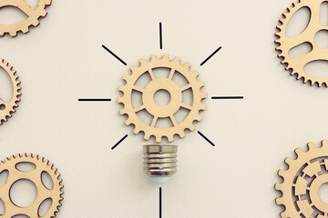 Spinning gear as light bulb concept. Idea of innovation and creativity © tomertu