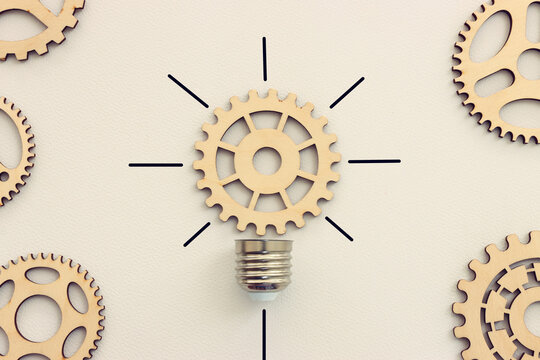 Spinning gear as light bulb concept. Idea of innovation and creativity
