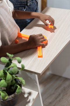Child building a marble run toy