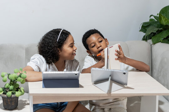 Children using tablets for e-learning and homework