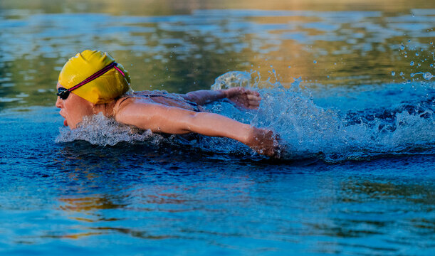White swimmer performing butterfly stroke