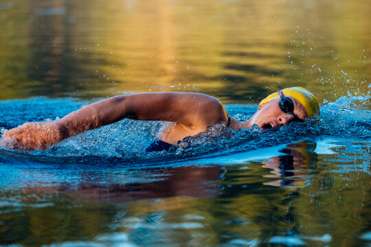 Female open water white swimmer performing freestyle stroke