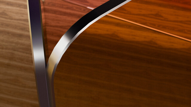 Close-up of glass edge on polished brown wood table surface