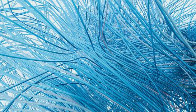Close-up of dense cluster of tangled blue wires creating complex