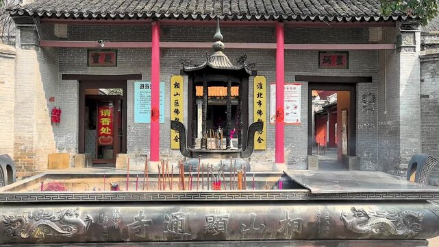 Incense burner and incense candles at Xiantong Temple, commonly known as Xiangshan Temple, first built in the Western Jin Dynasty. Huaibei City, Anhui Province, China.