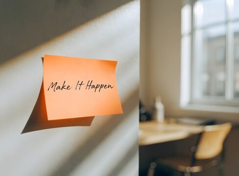 Bright Orange Post It Note Saying Make It Happen On Wall