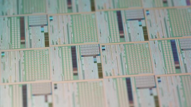 wafer silicon monocrystalline  with microchips after photolithography etching manufacturing reflecting different colors used in fabrication of electronic integrated circuits.