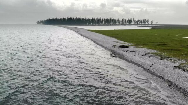 Lake Baikal coastal lagoons show stone barrier formation along a changing freshwater shoreline.