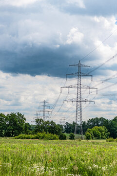 Green nature energy. Landscape of electric voltage station. High voltage. Electricity pylon structure. Nature summer environment. Electricity tower. Electricity power lines in nature landscape